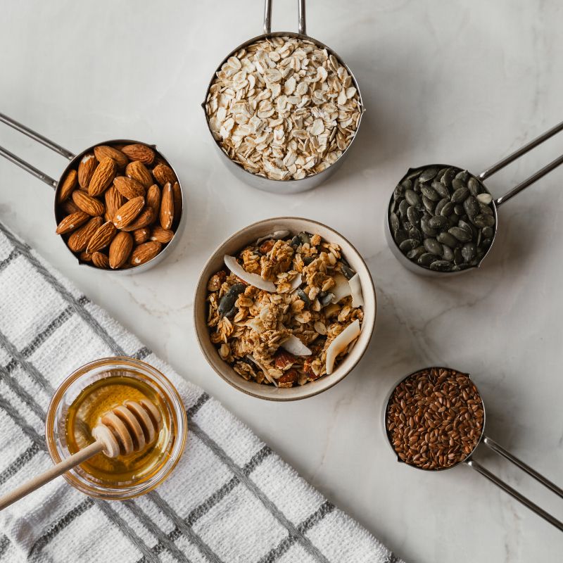 Natural whole ingredients in Nom Classic Granola oats almonds honey mixed seeds no refined sugars
