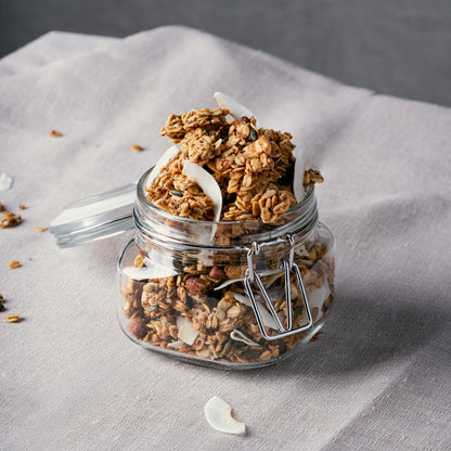 Honey sweetened Nom Classic granola clusters with almonds cashews coconut seeds and cinnamon