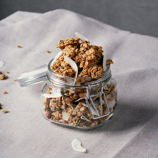 Honey sweetened Nom Classic granola clusters with almonds cashews coconut seeds and cinnamon