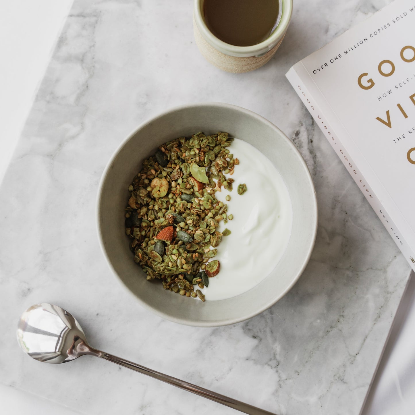 Bowl of Matcha + Nut Nom Granola with yogurt perfect healthy artisan breakfast
