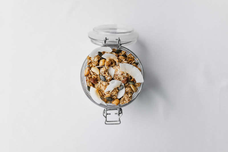 Nom Classic artisan granola in a glass jar honey sweetened with almonds cashews coconut seeds and cinnamon